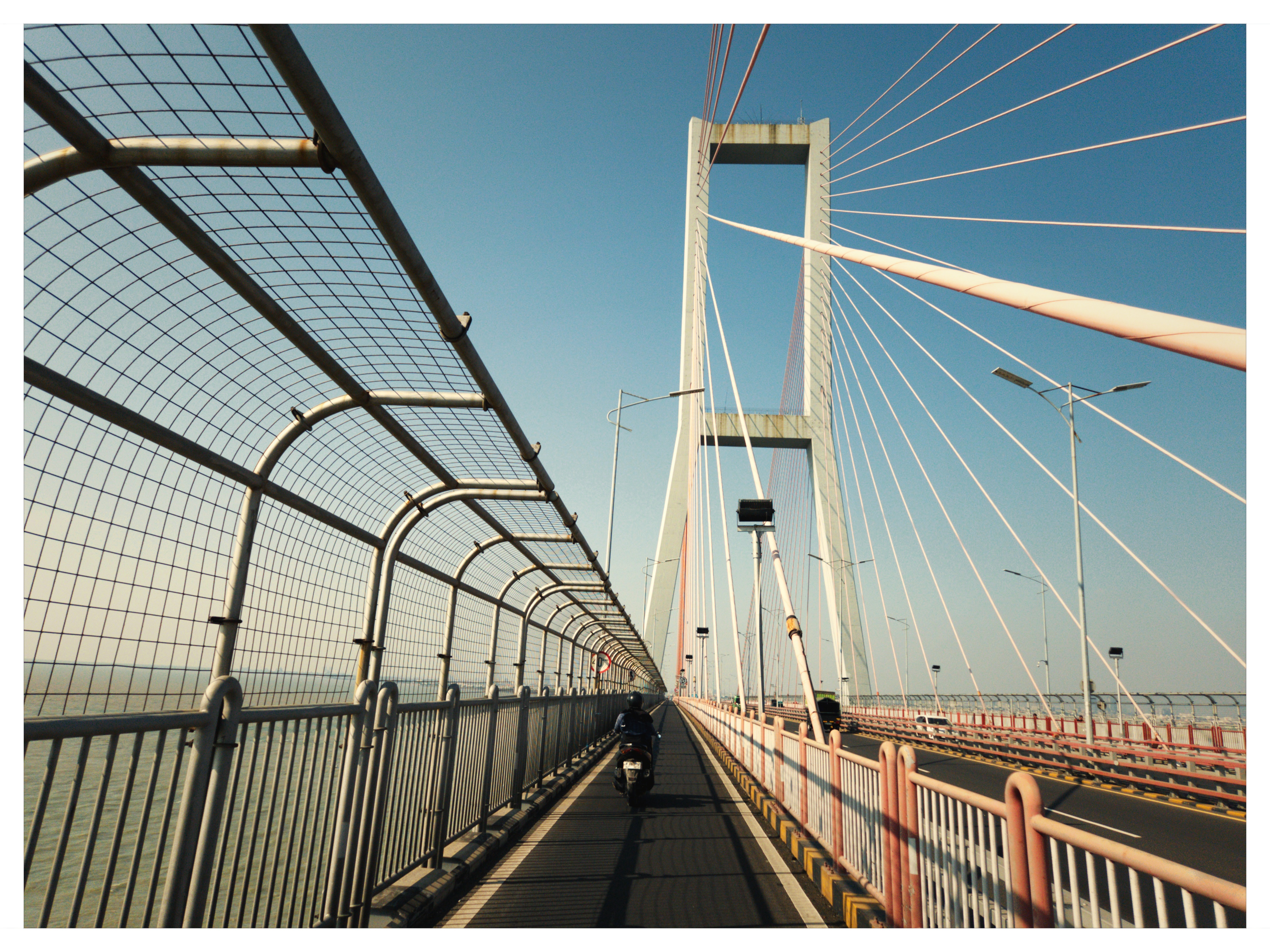 Suramadu suspension bridge steel mesh and soaring sky shot on NeoFilm Amber Transit 200