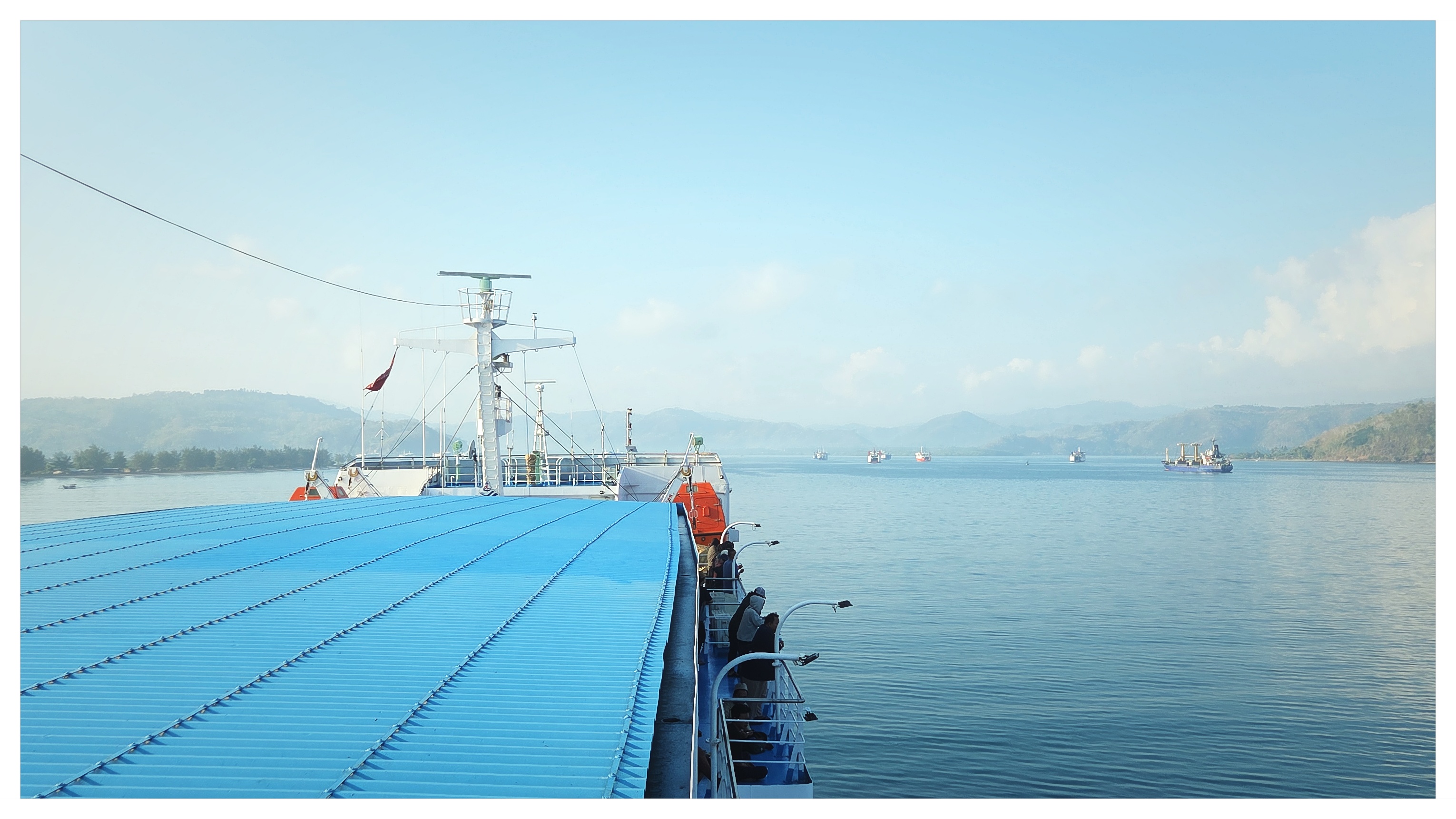 Broad marine horizon viewed from ship deck at Port of Gili Mas shot on NeoFilm Superia 400