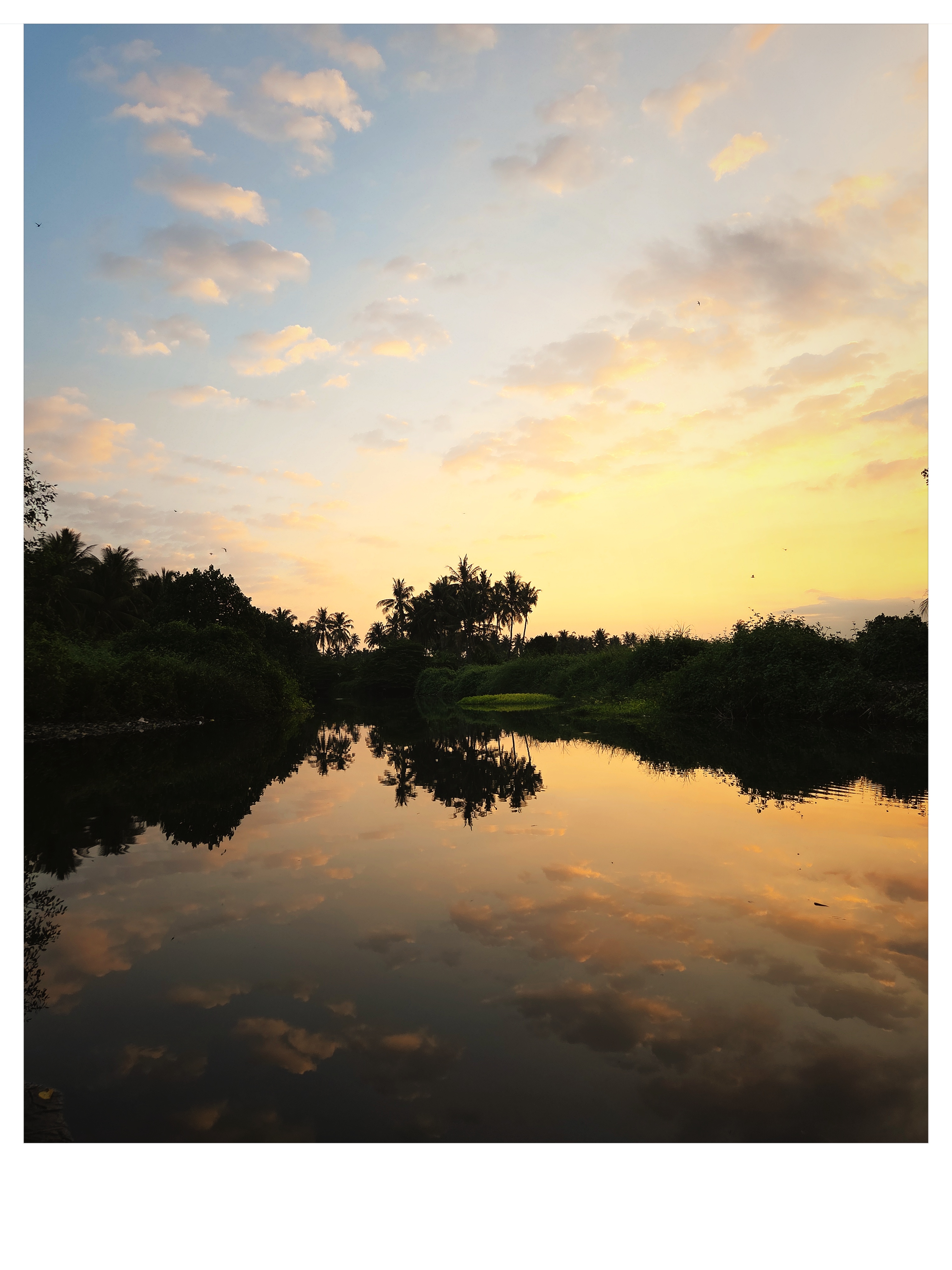 Gentle river curves reflecting sunset glow in East Lombok shot on NeoFilm Instant Memory 600