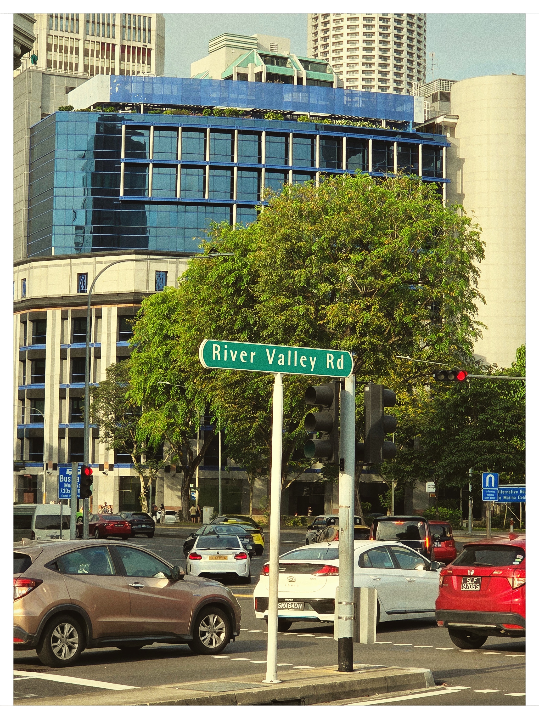 Street sign and bustling traffic on River Valley Road Singapore shot on NeoFilm FX Daily 400