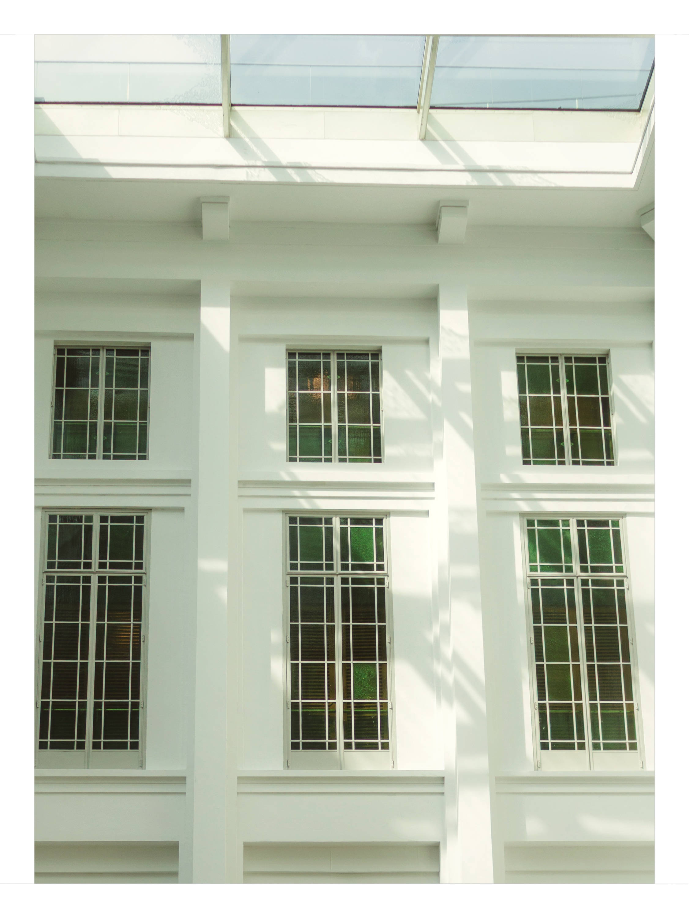 Geometric skylight canopy and neoclassical colonnade shot on NeoFilm Creamsicle Sun 160