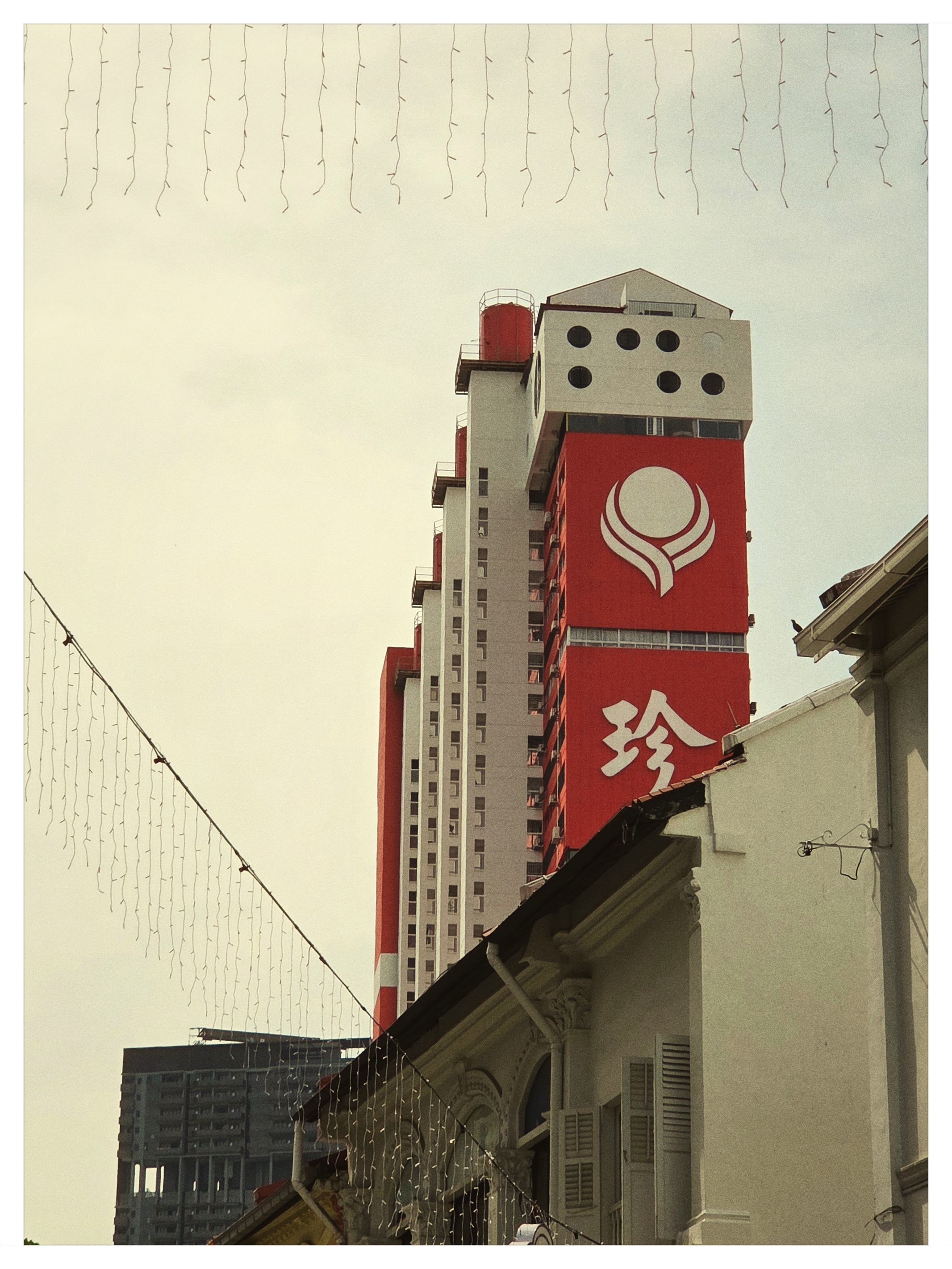 Iconic red People's Park Complex brutalist high-rise in Singapore Chinatown shot on NeoFilm FX Daily 400
